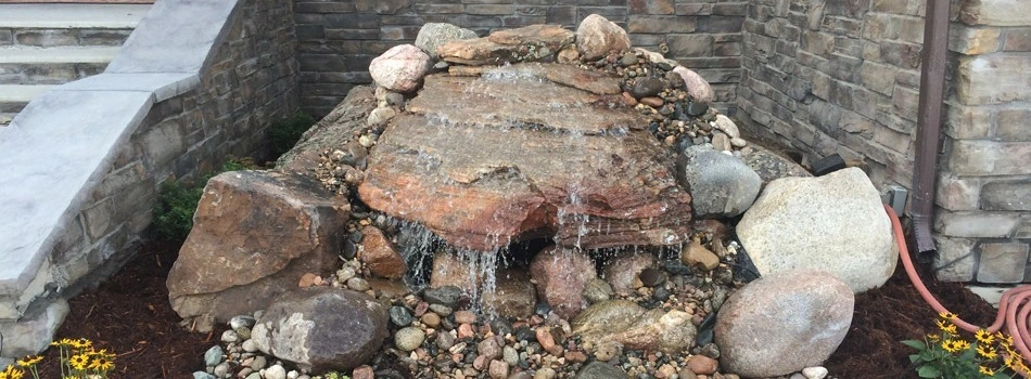 This homeowner opted to have a custom rock water fountain installed in front of their Loveland home.l