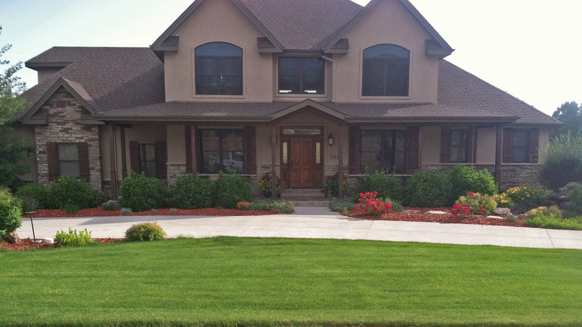 A great example of a professionally planned and installed landscape bed outside a home in Loveland, CO.