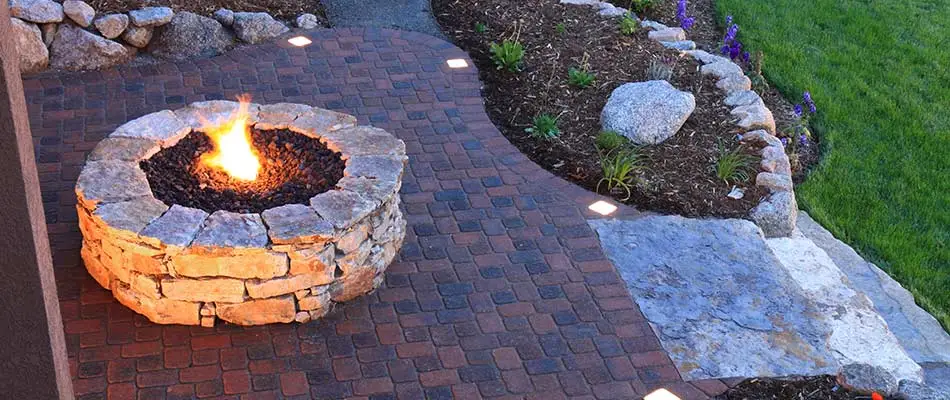 Stacked stone fire pit construction in Loveland, CO.