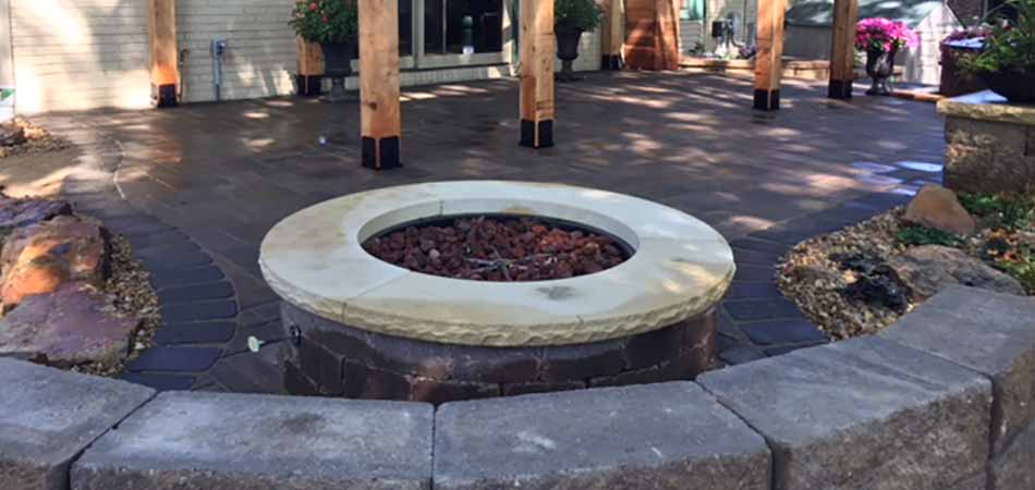Gas burning fire pit that was custom-built for homeowner in Windsor.