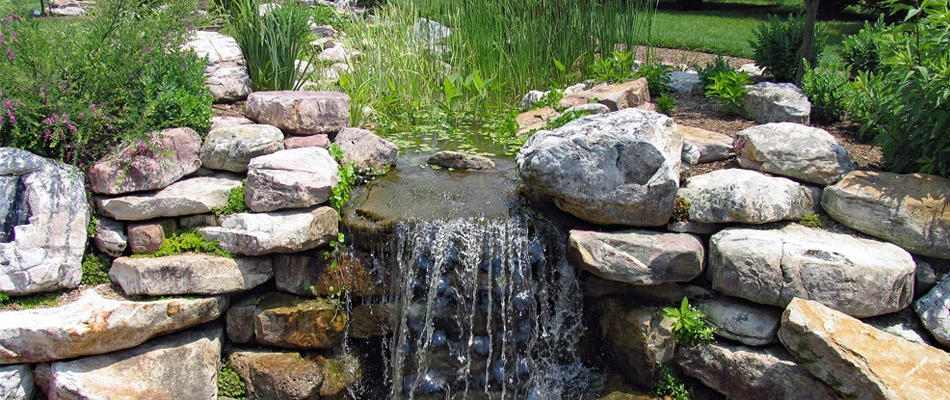 Why Your Outdoor Living Space Needs Custom Water Features