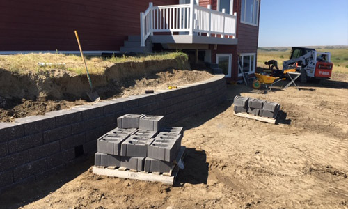 Large retaining wall being built at a property in Windsor, CO.