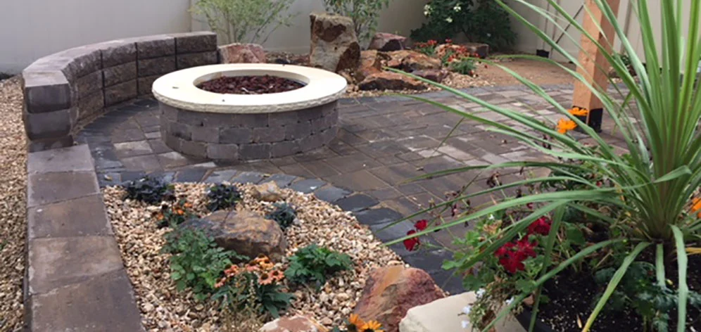 The finishing touches of this beautiful and functional hardscape project in Fort Collins was a landscape bed and river rock.
